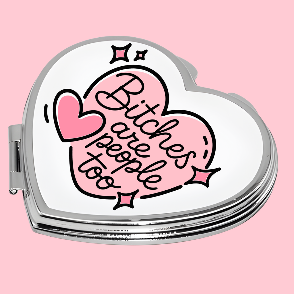 Heart-shaped compact mirror with 'Bitches are people too' text on a pink background