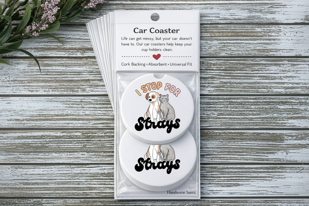 Car coaster set with dog and cat illustration in packaging on a wooden surface